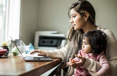 Mother working from home with infant