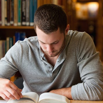 Man studies in a college library