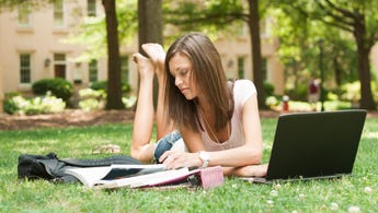 College student studies outside
