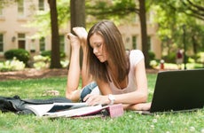 College student studies outside