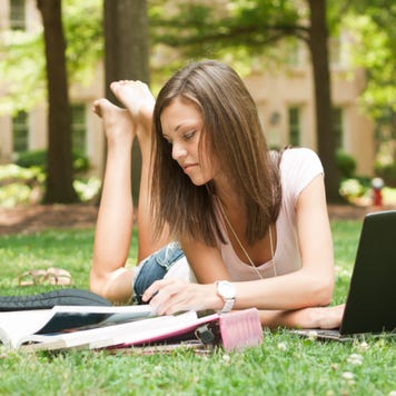 College student studies outside