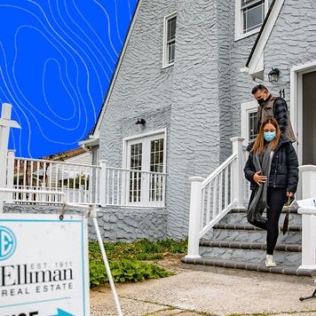 A family walks out of a gray house