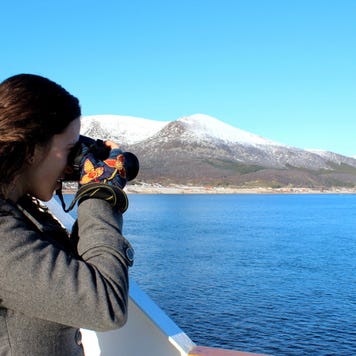 Woman on cruise taking photographs