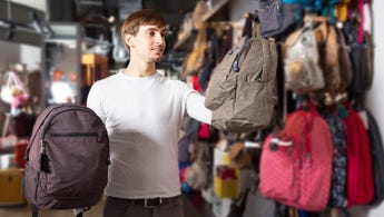 Man shops for backpacks
