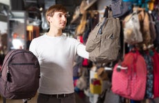 Man shops for backpacks