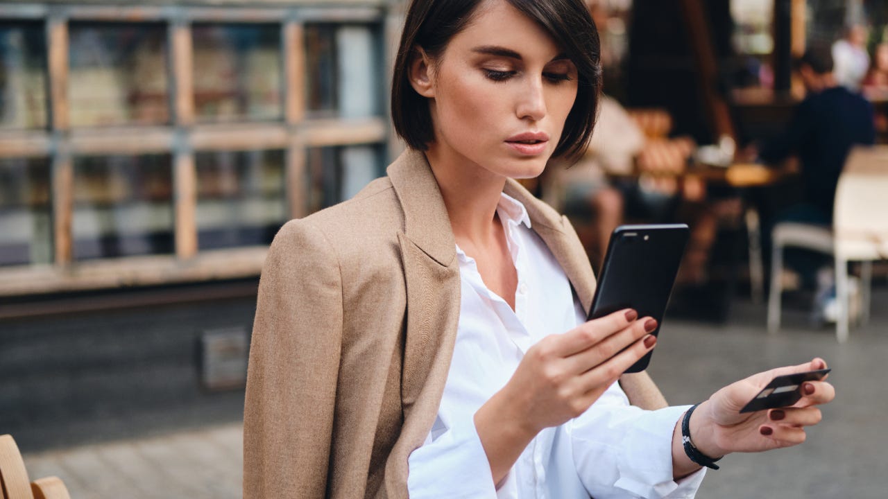 Young woman looking at smartphone