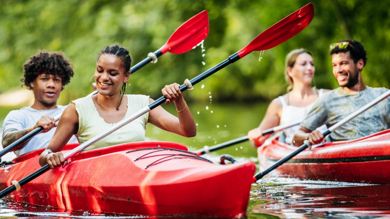 Group of young people kayaking