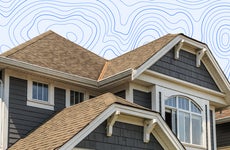 A house roofline in front of a graphic background.