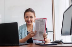 Young Asian businesswoman giving online presentation discuss contract details with client giving consultation, making video call on laptop computer