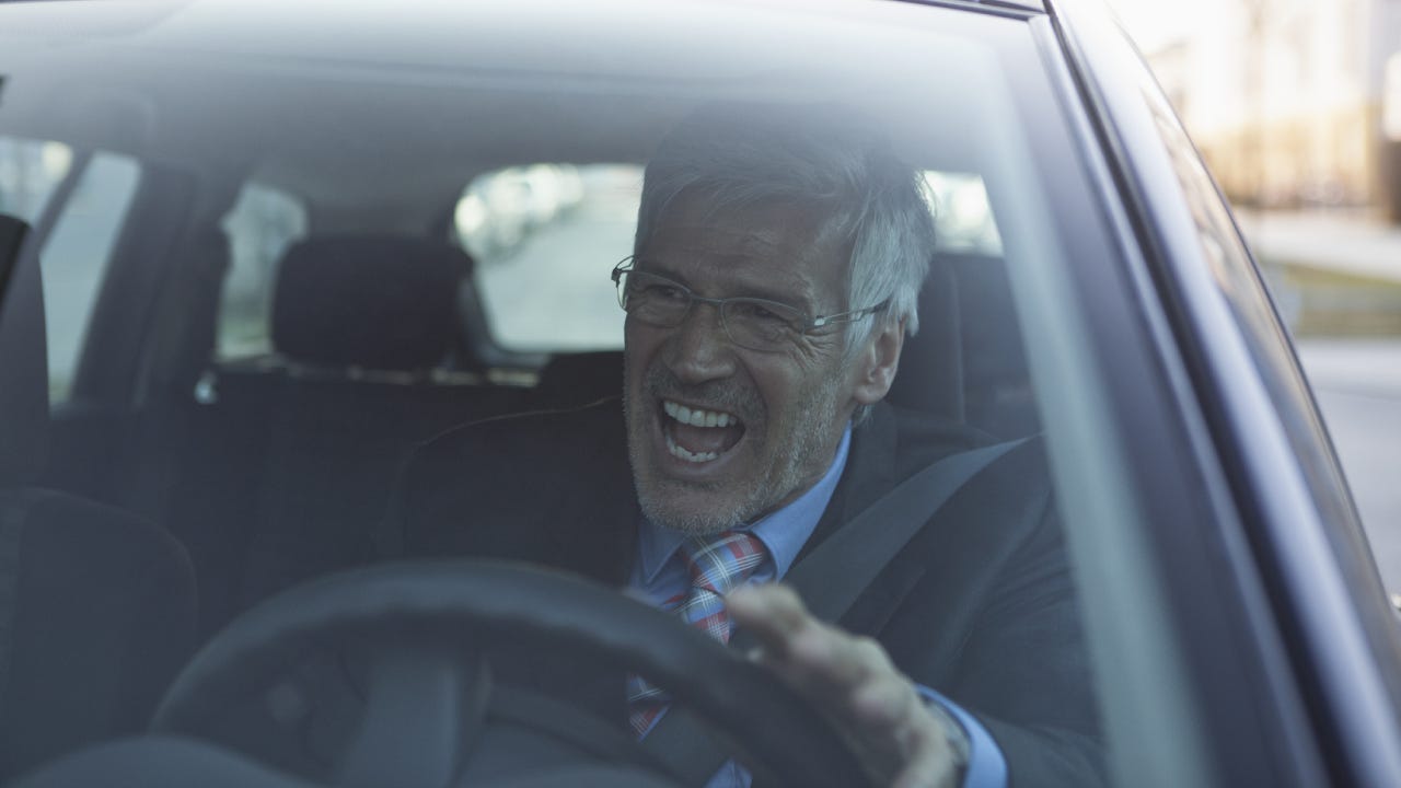 Angry businessman in his car
