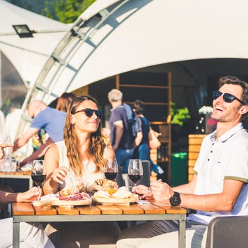 Friend eating at outdoor restaurant in Italy