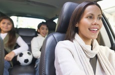 USA, New Jersey, Jersey City, Mother with son (12-13) and daughter (10-11) in car