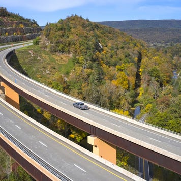 USA, West Virginia, Aerial view ofU.S. Route 48 bridge stretching over Lost River inAppalachian Mountains