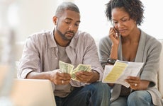 Black couple paying bills