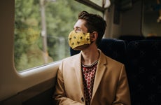 Man in face mask on train