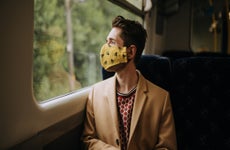 Man in face mask on train