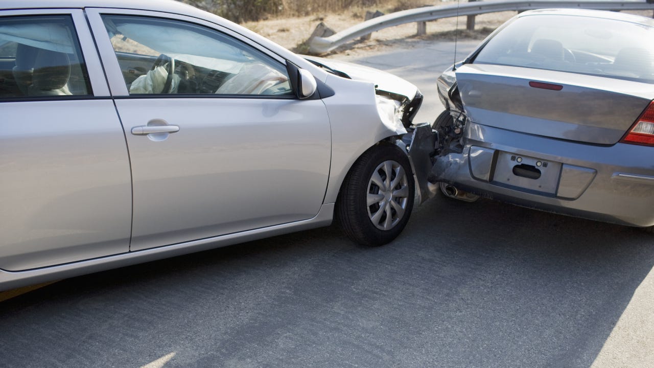 Two cars in collision on roadway