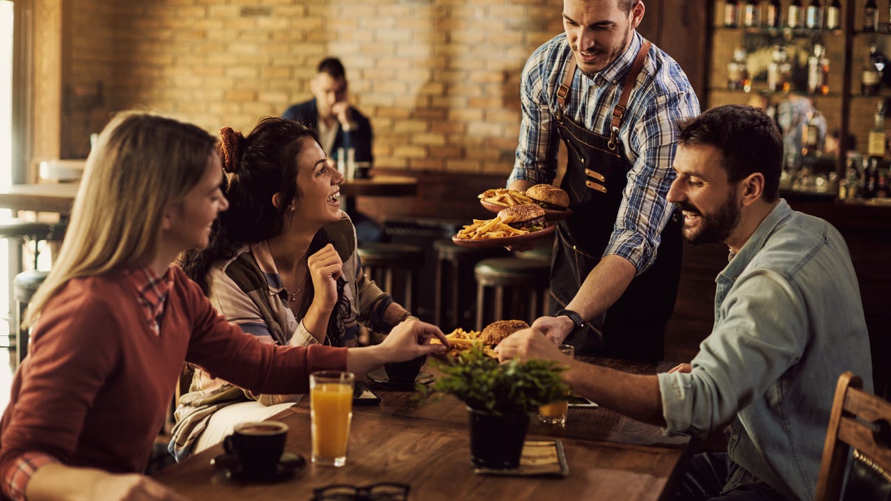 Young people dining at restaurant