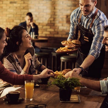 Young people dining at restaurant