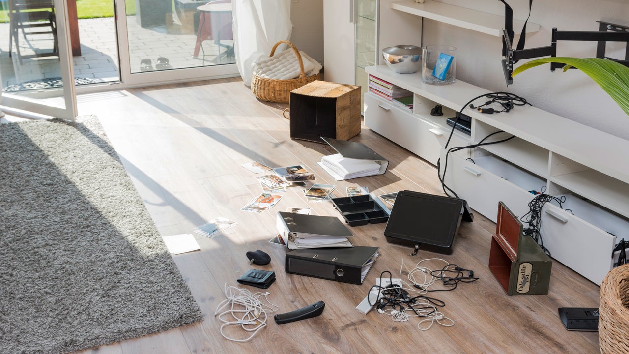 ransacked items on the floor of a living room