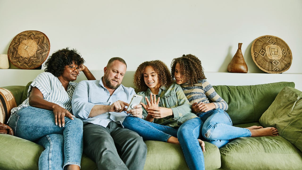 Family looking at smatphone