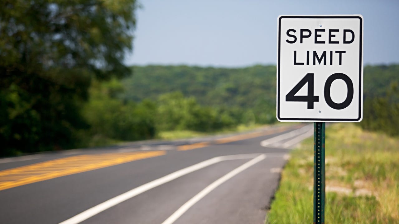 Speed limit sign by the road