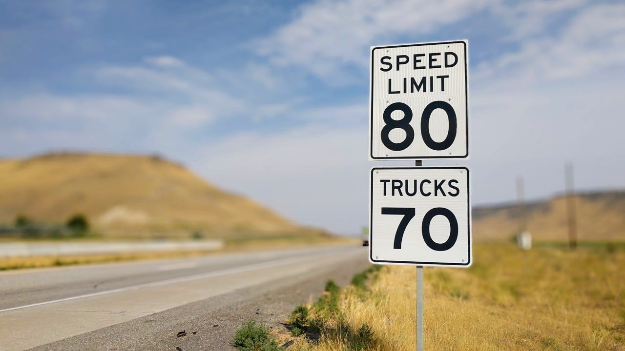 Close-Up Of Speed Limit Sign Against Sky