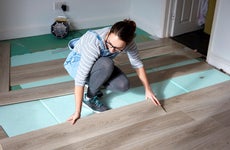 woman installing new floors
