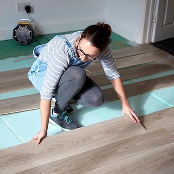 woman installing new floors