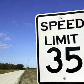 Speed limit sign in rural setting