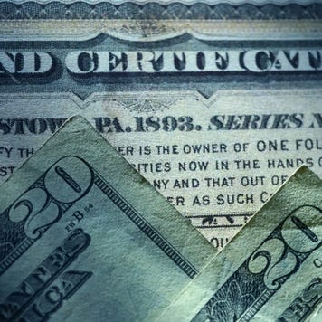 A picture of a corporate bond and some $20 bills