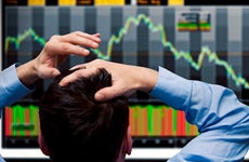A man watches a falling stock chart