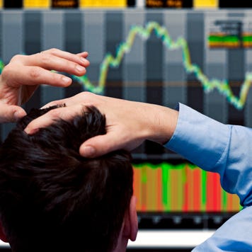 A man watches a falling stock chart