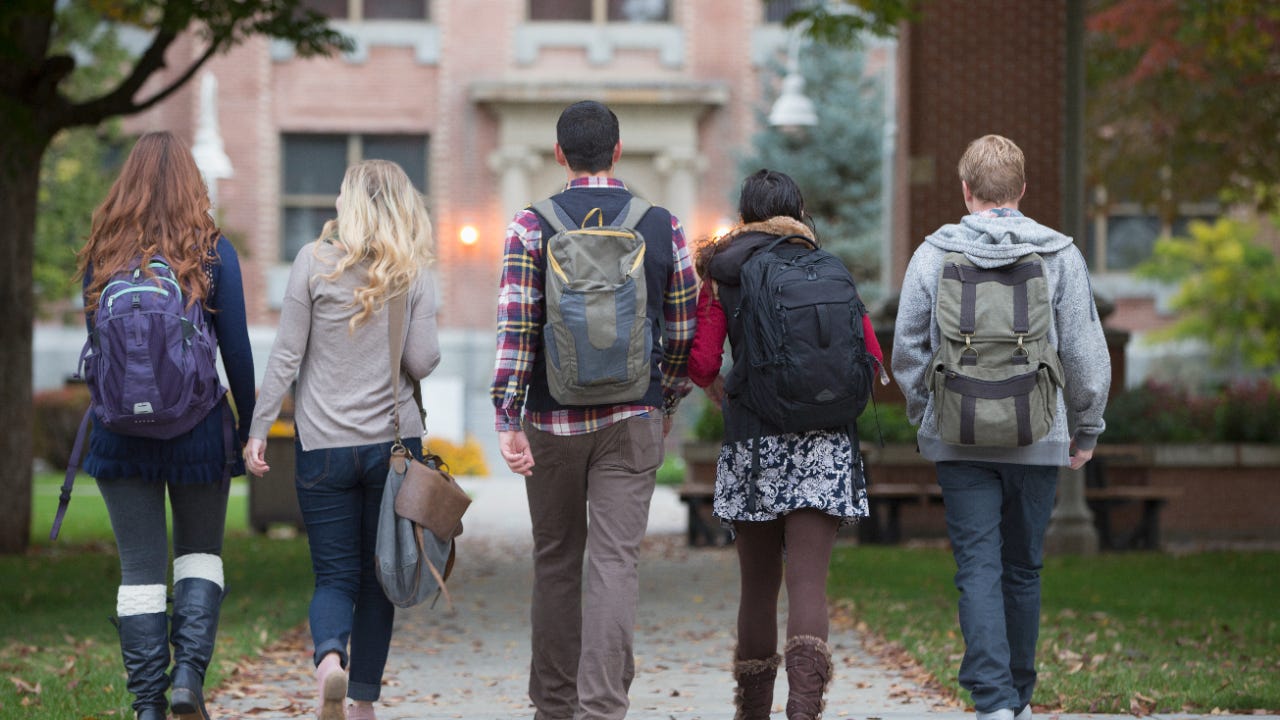 Group of college students walking on campus