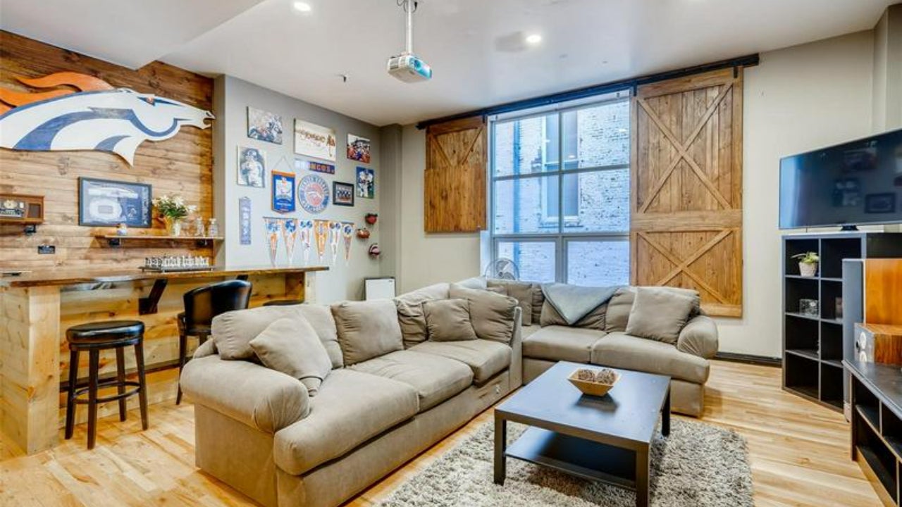 Denver bachelor pad with sports memorabilia all over the wall