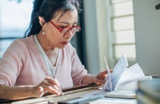 Senior woman doing finances at home