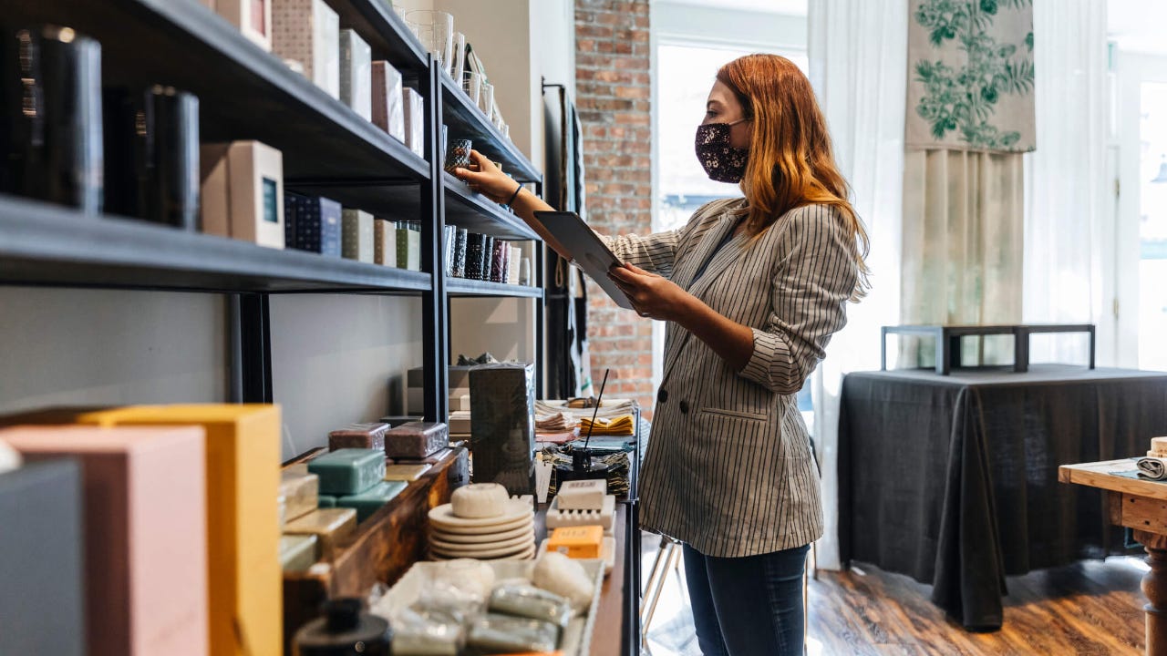 Small business owner takes inventory in her shop