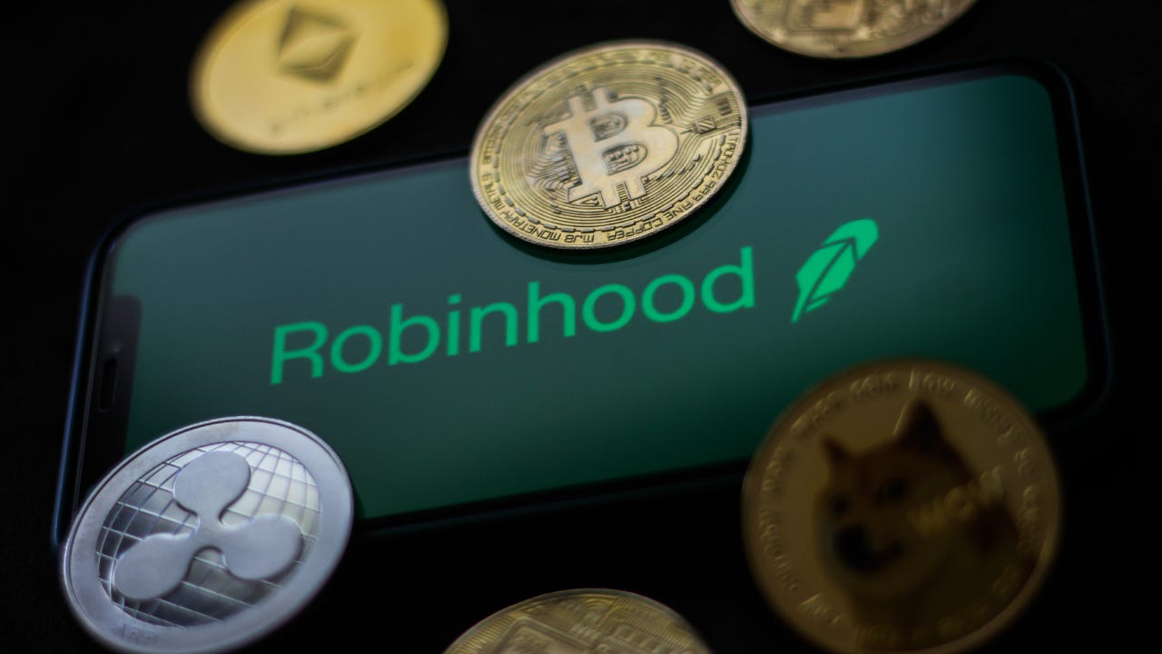 A Robinhood logo with physical versions of crypto coins