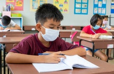 Elementary school wear mask for protect corona virus are studying.