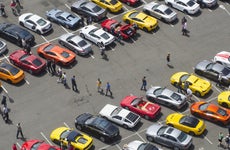 Aerial view of people walking in parking lot