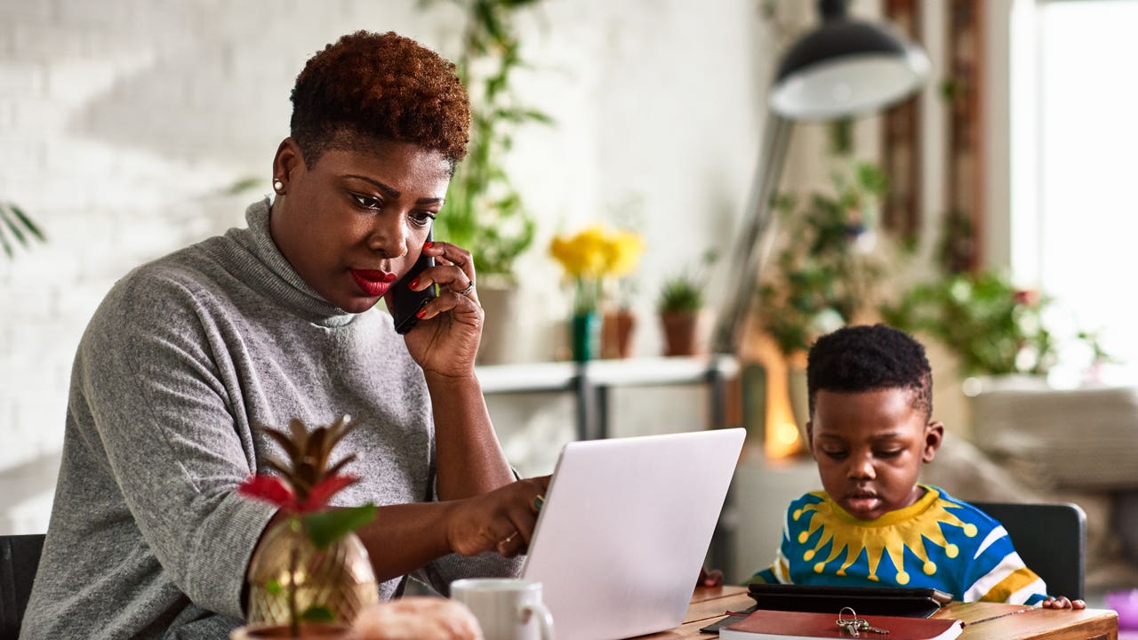 woman on the phone at home with her son