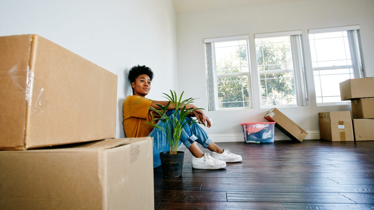 Young Black woman moving into a new apartment