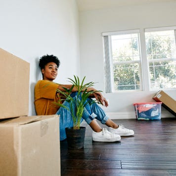 Young Black woman moving into a new apartment
