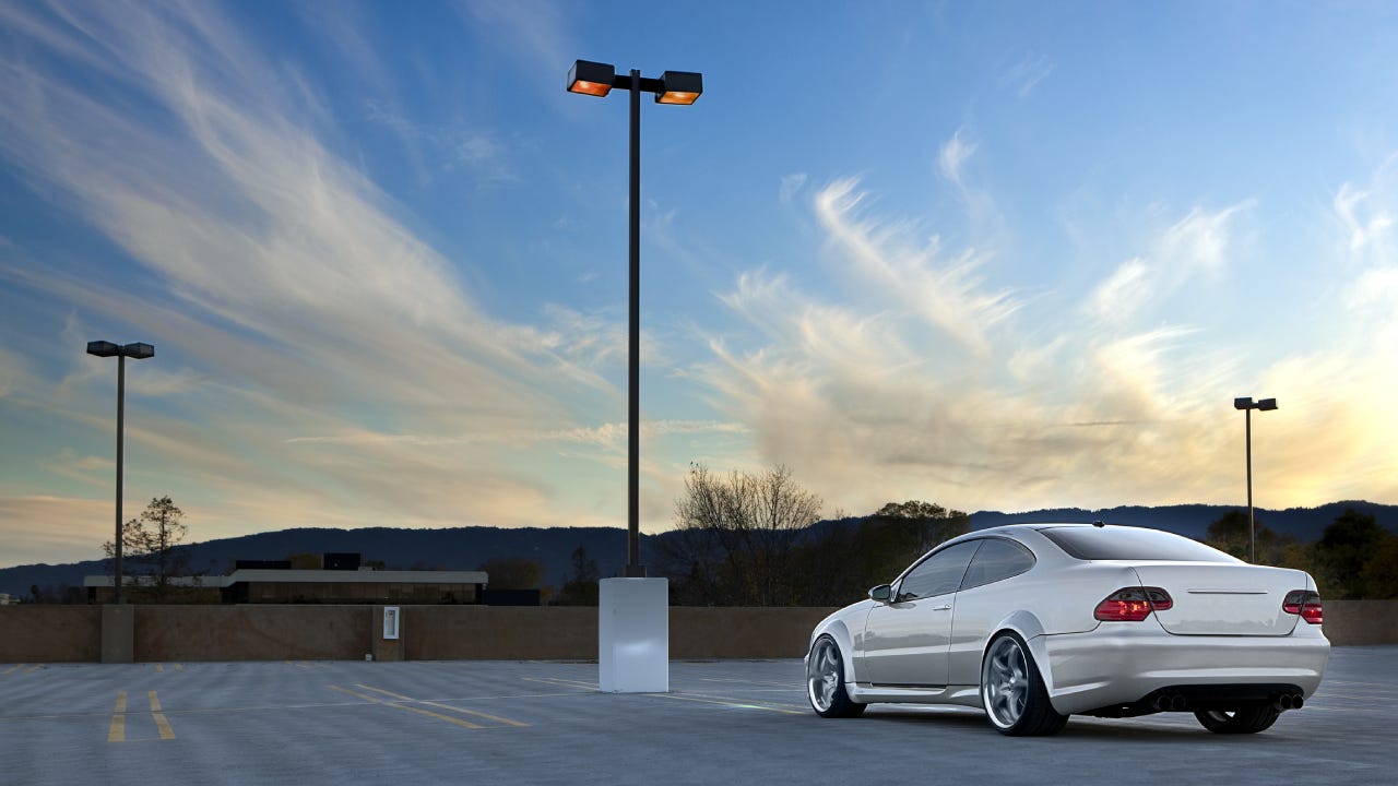 Car parked in empty parking lot