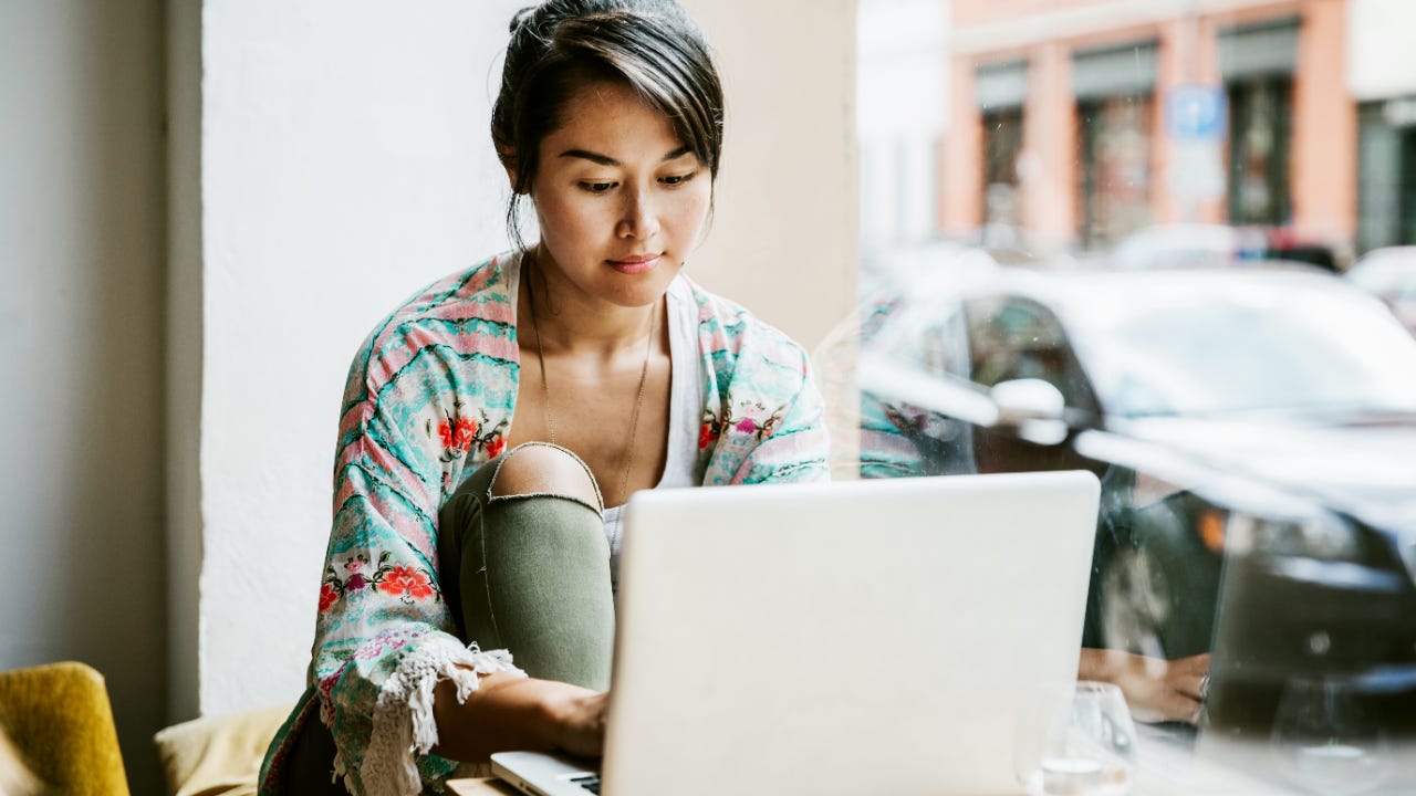 Woman works on laptop