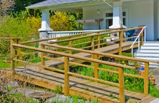 Home with wooden wheelchair ramp