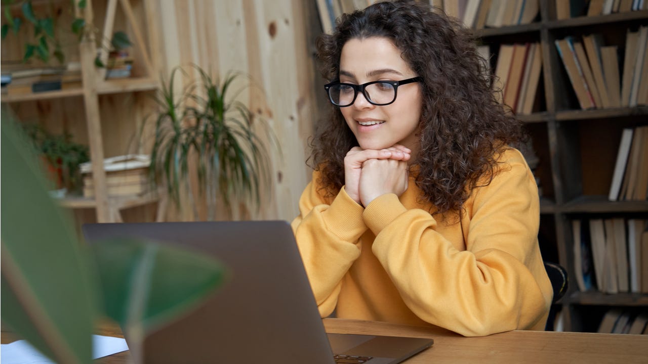 High school student works on a laptop