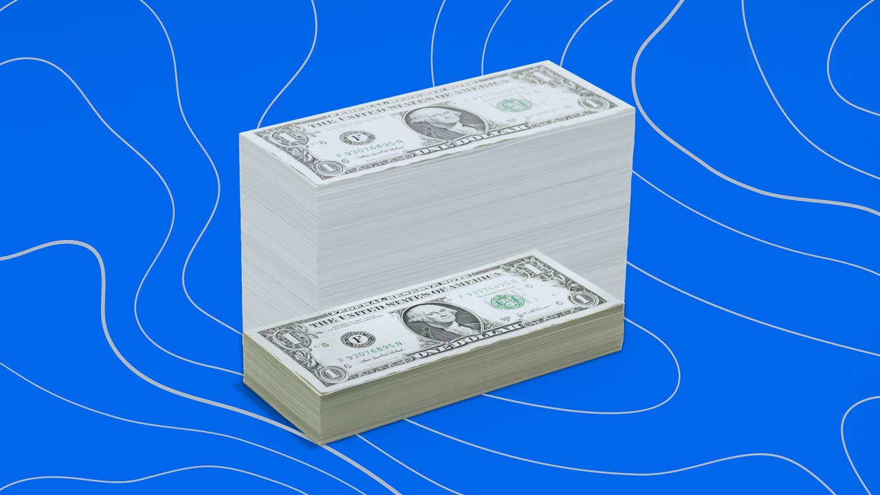 US dollar bills against blue background