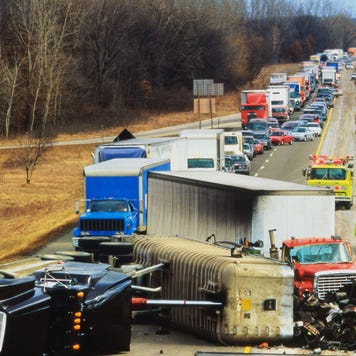 Truck overturned on highway, traffic jam behind