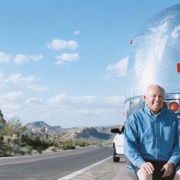 older couple outside trailer home